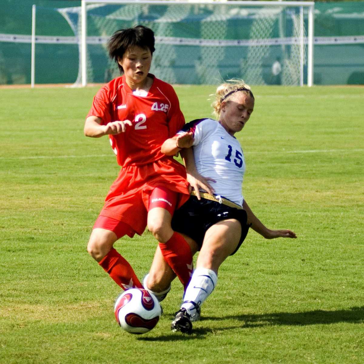 A football player tackling an opponent from
behind